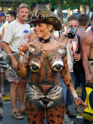 P.S. Very popular at Mardi Gra. (с). Naked but for body paint. 